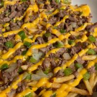 Philly Cheese Fries · Seasoned shaved beef, chopped bell peppers and onions, cheese whiz
