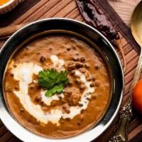 Dal Makhani · Black Lentils Prepared in Light Cream and Touch of Butter and Garnished with
tomatoes, onion...
