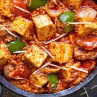 Karahi Paneer · Homemade cheese cooked in green peppers with a touch of hot spices.