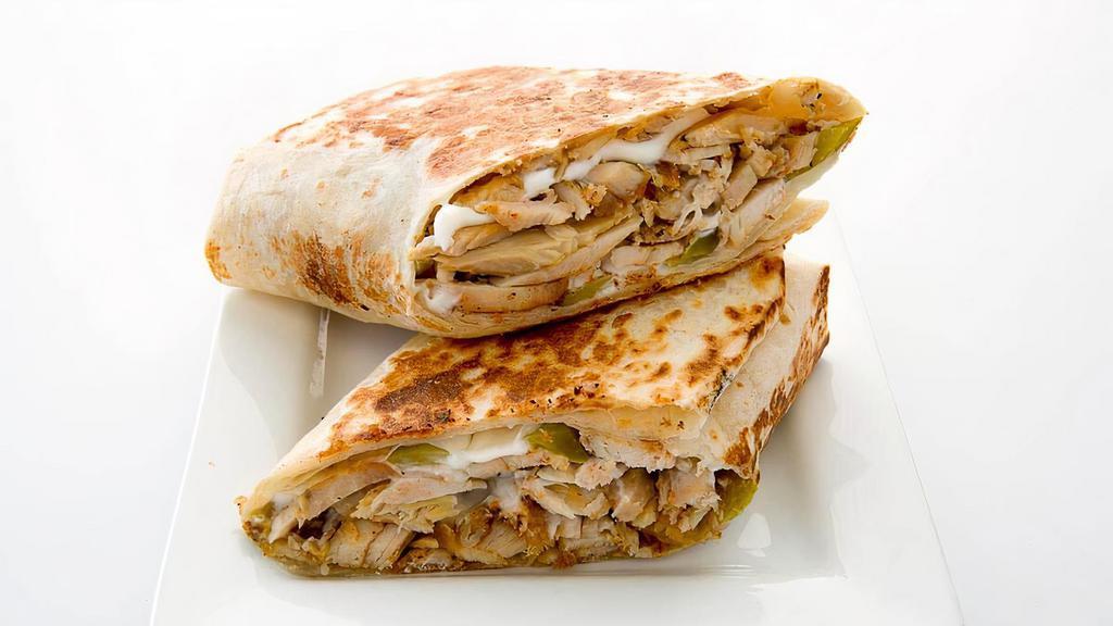 Chicken Shawarma · Thin sliced seasoned tender chicken served with  tomatoes, pickles and garlic sauce.