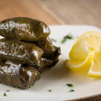Grape Leaves · Stuffed grape leaves with seasoned rice and steamed served cold with cucumber salad.