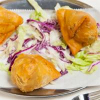 Vegetable Samosas · Crisp pastry filled with a mildly spiced mixture of potatoes and peas.