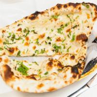 Garlic Naan · Leavened flour stuffed with mildly spiced garlic and cooked in tandoor.