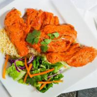 Tandoori Chicken Tikka · Chicken cubes marinated in spices, herbs, yogurt and roasted in our clay oven. Served with y...
