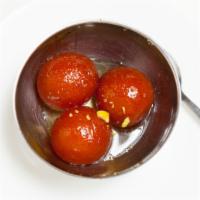 Gulab Jamun · Fried milk dumplings served warm in sweet syrup flavored with rosewater.