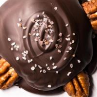 Turtles (Vegan Pecan) · A dark chocolate bottom, a dark chocolate top, a vegan caramel center, pecan feet and topped...