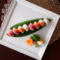 Rainbow Roll · California roll with tuna, salmon, avocado on top.
These items are cooked to order or may co...