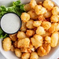 Cheese Curds · White cheddar, hand-battered, served with ranch dressing