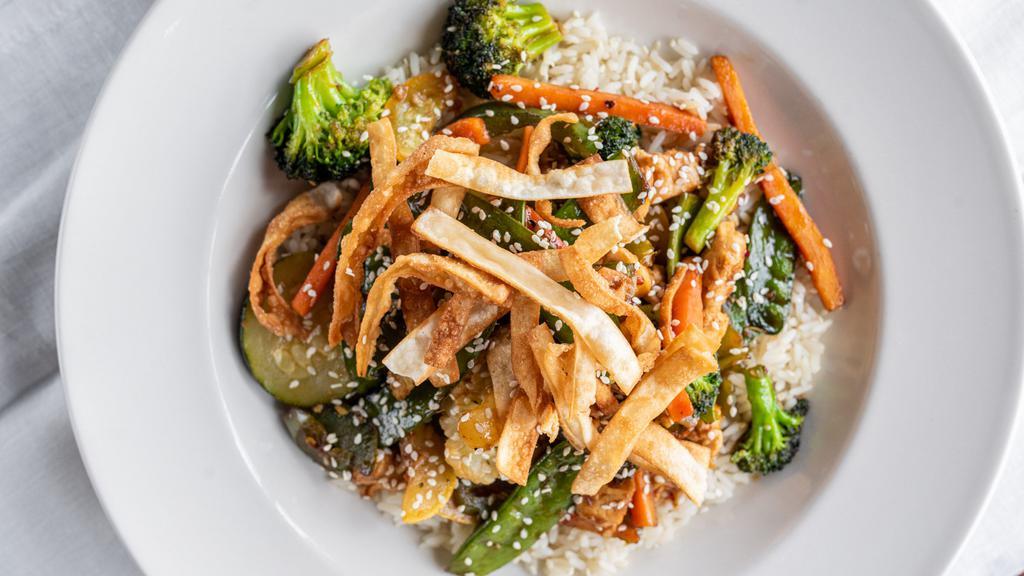 Chicken Stir Fry · Chicken, Broccoli, Carrots, Onions, Pea Pods, Red Peppers Sautéed in Sesame Oil. Tossed In Our House-Made Stir Fry Sauce Over White Rice & topped with Crispy Wontons
