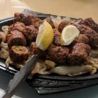 Seekh Kabab · Finely minced lamb seasoned with chopped onions, herbs and spices then baked on skewers in o...
