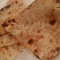Peshawari Naan · Unleavened white bread stuffed with cashews, and raisins.