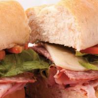 Italian Sub Sandwich · Hand sliced Fannestil ham, Genoa salami and provolone cheese topped with lettuce, tomato and...