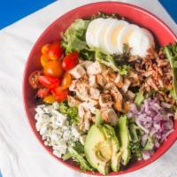 Cobb Salad · Mixed greens, avocado, tomatoes, hard boiled egg, chicken, onions, bacon, blue cheese.