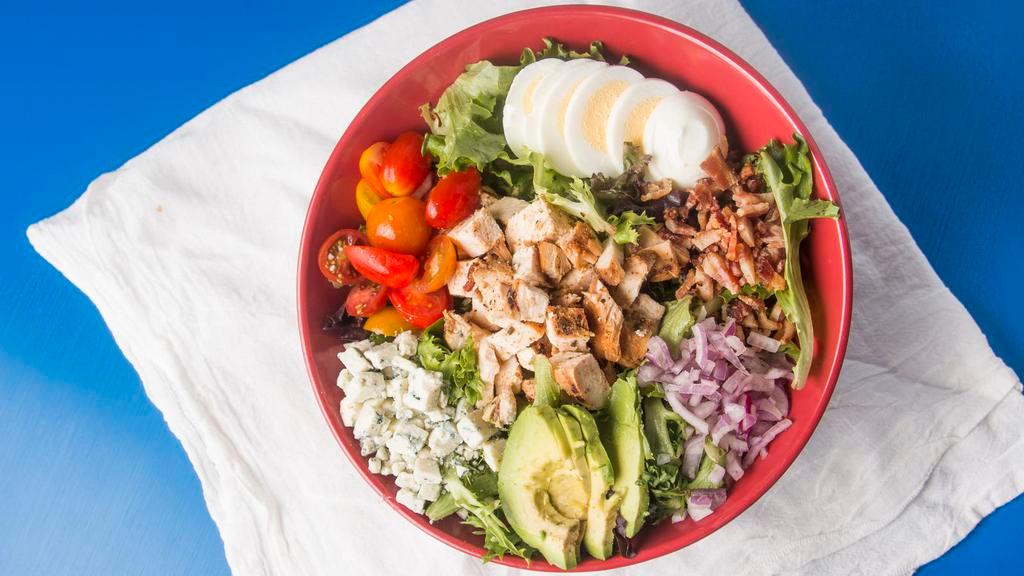 Cobb Salad · Mixed greens, avocado, tomatoes, hard boiled egg, chicken, onions, bacon, blue cheese.