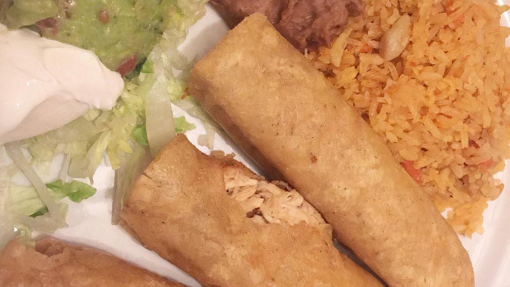 Flautas (3) · A deep-fried corn tortilla filled with choice of beef or chicken. Served with sour cream and guacamole.
