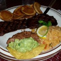 Carne Asada · Skirt steak grilled to your order. Served with rice, beans, guacamole, and Mexican papas.