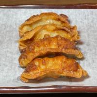 Dumplings (4Pc) · Pan-fried pork and chicken dumplings.