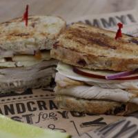 #3 Turkey Brie Sandwich · Grilled Cranberry Bread with Oven Roasted Turkey, Brie cheese, Sliced Apple, Red Onions and ...