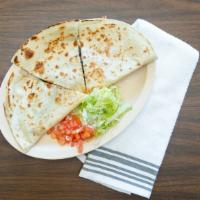 Sincronizada · Large flour tortilla with ham and cheese.