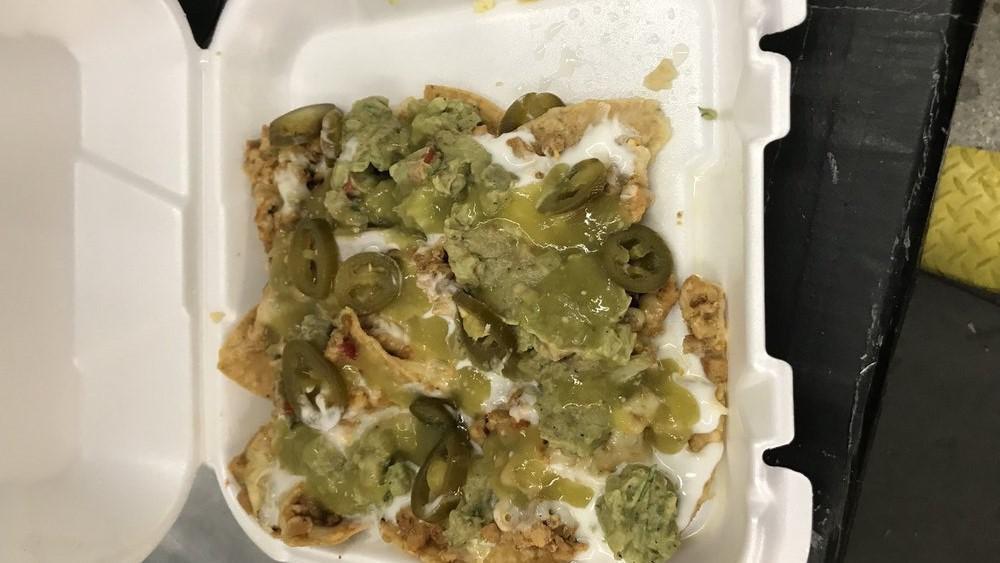 Super Nachos With Meat · Tortilla Chips w/beans, cheese, guacamole, sour cream, jalapeños & choice of meat.