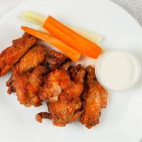Buffalo Wings · Chicken wings deep-fried to perfection, tossed with your choice of sauce. Served with celery...
