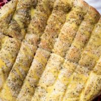Toarmina Bread · 16 piece breadstick with butter our own italian seasoning and romano cheese.