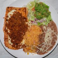 El Westgate Burrito · Stuffed with chicken, chorizo, beans and rice, tomato, lettuce, cheese, sour cream, then top...