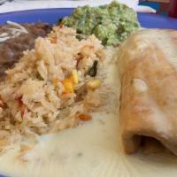 Chimichanga · Your choice of meat covered with cheese dip sauce served with guacamole salad rice and beans...