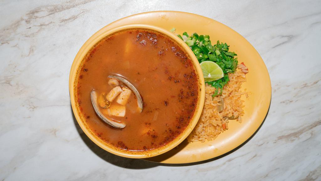 Caldo De Siete Mares · Seven seas soup includes clam, catfish, shrimp, and squid.