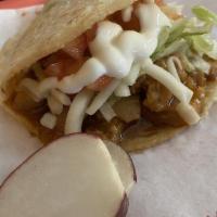 Gordita · Hand-made thick tortilla stuffed with choice of meat, beans, lettuce, tomato, cheese, sour c...