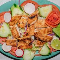 Jaliciense Chicken Salad · Grilled chicken salad made with lettuce, tomato, cheese, avocado, and served with ranch dres...