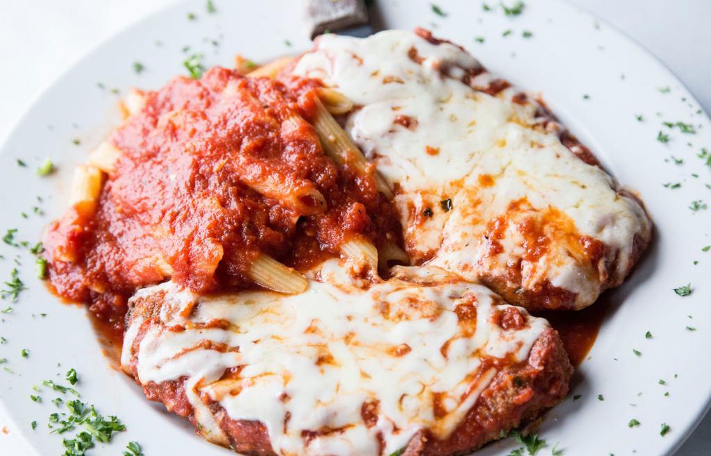 Chicken Parmigiana Dinner · Boneless chicken filets in our own breading, baked with mozzarella & tomato sauce, served with side of penne with marinara.