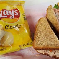 Tuna Salad Sandwich With Chips · On toasted wheat or white bread with lettuce and tomato.
