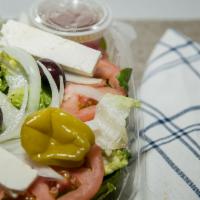 Greek Salad · Romaine lettuce, tomato, onion, Greek olives, Feta cheese, pepperoncini and homemade Greek d...