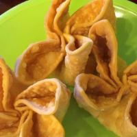 Crab Rangoon · Crispy wonton skin filled with a creamy mixture of real crabmeat and cream cheese. Served wi...