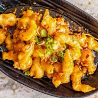 Orange Chicken (Regular) · Breaded, topped with green onion, orange peels; spicy brown sauce.