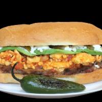 Torta La Mexicana · Steak, Two Scramble Eggs Cooked With Spicy Red Salsa, Mexican Queso Fresco, Avocado, Jalapeñ...