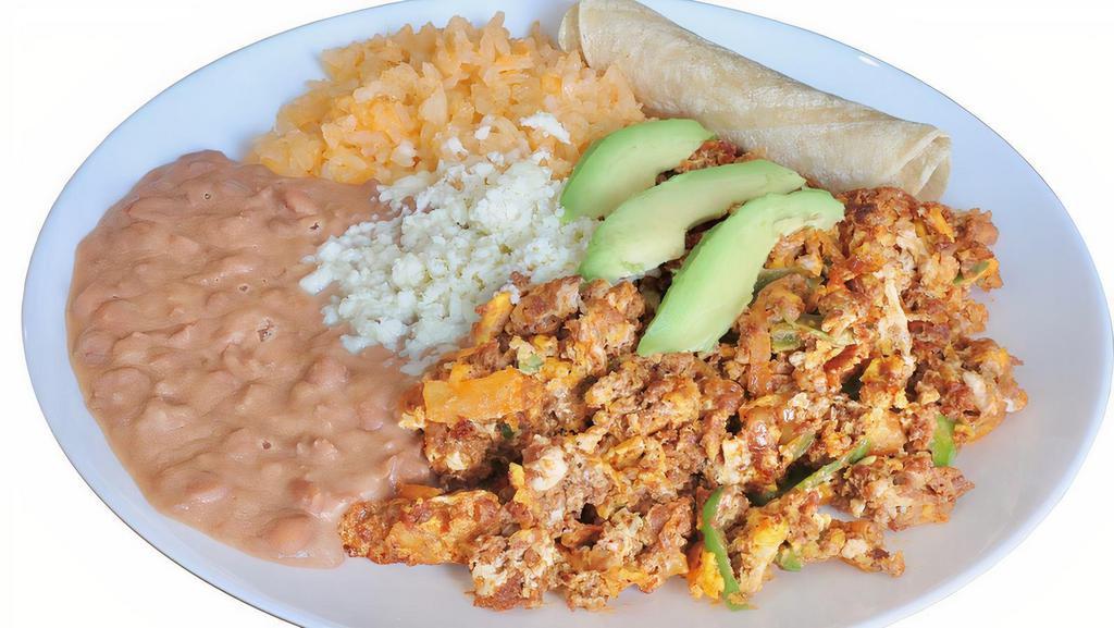 Huevos Con Chorizo Pl. · Scramble Eggs with Chorizo, Tomatoes & Onions. Served with Rice and Refried Beans. Topped with Queso fresco on the Beans and Avocado Slices. Enjoy it with Corn Tortillas and Homemade Salsa.