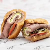 Roast Beef & Provolone · Dressed with lettuce, tomatoes, red onions, pickles, black olives, crushed cherry peppers, b...