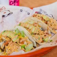 Baja Chicken Tacos · Grilled Chicken topped with bacon, shredded cheddar cheese, sliced avocado, lettuce, tomatoe...