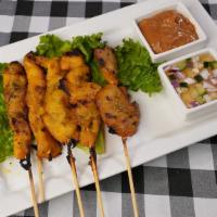 Chicken Satay (5Pcs) · Marinated and char-broiled and served on sticks with peanut sauce and cucumber salad