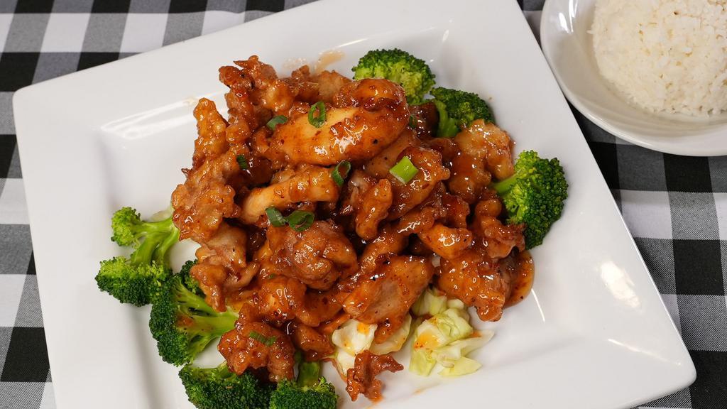 Volcano Chicken · Lightly batter fried chicken sauteed in sweet and hot chili sauce served on the bed of steamed vegetable