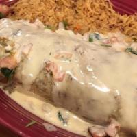Burrito Carne Asada · A burrito filled with carne asada, onions, peppers, and beans. Then smothered with cheese an...