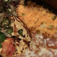 El Rodeo Combo · One beef burrito topped with cheese sauce, one chicken enchilada, topped with mole sauce and...