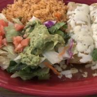 Verdes Enchilada · Three chicken enchiladas topped with green tomatillo sauce and melted cheese. Served with le...