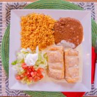 Chimichangas · Two flour tortillas stuffed with chicken, steak, or ground beef, then deep-fried and topped ...