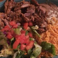 Carnitas Dinner · Our tender roast pork is served with rice, beans, pico de gallo, crema salad, and three soft...