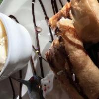 Xango · Creamy cheesecake wrapped in a pastry tortilla, fried golden dusted with cinnamon and sugar,...