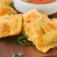 Fried Four Cheese Ravioli With Pizza Sause  · A signature blend of Ricotta, Mozzarella, Imported Romano and Asiago cheeses wrapped in fres...