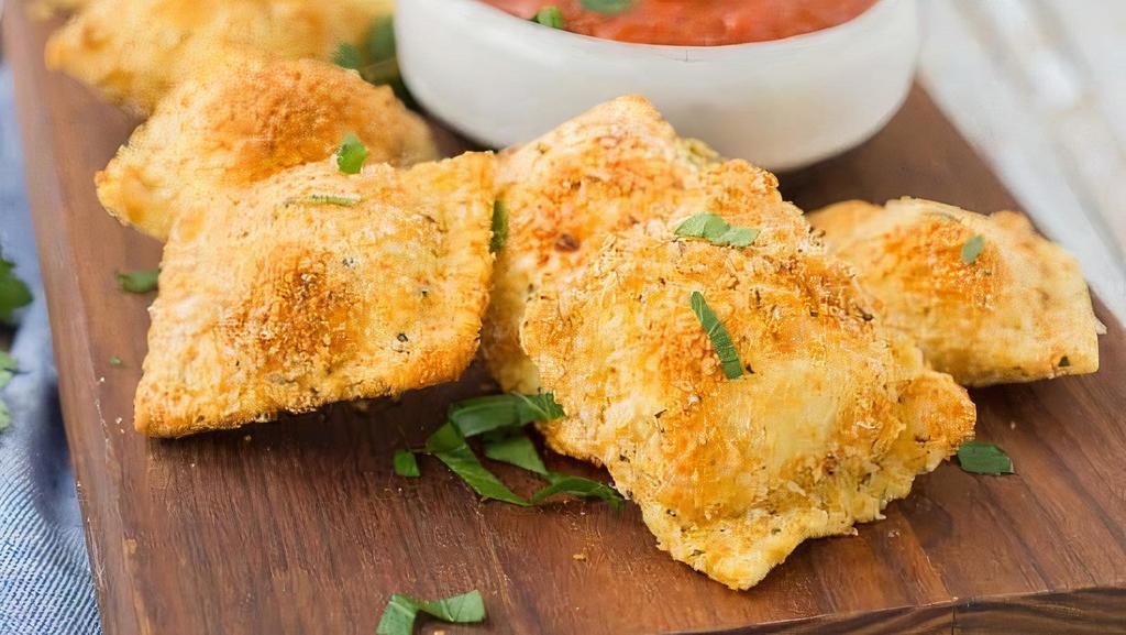 Fried Four Cheese Ravioli With Pizza Sause  · A signature blend of Ricotta, Mozzarella, Imported Romano and Asiago cheeses wrapped in fresh pasta and coated in Italian breadcrumbs.